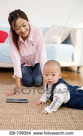 Picture - Mother and son playing together. Fotosearch
