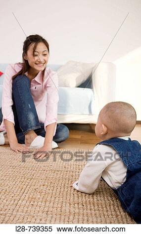 Mother and son playing together View Large Photo Image Stock Photography - Mother and son playing together. Fotosearch