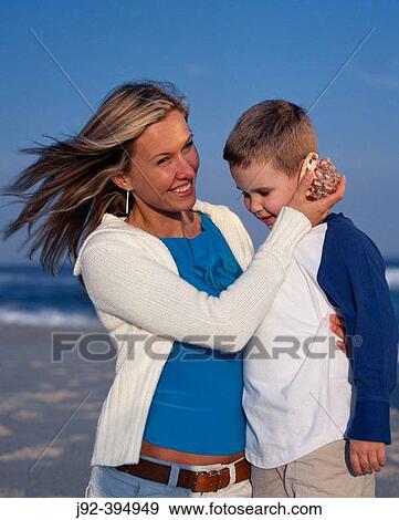 Mother and Son Sharing a Special MomentJones Beach New York State United states of America View Large Photo Image Stock Photo - Mother and Son Sharing a Special MomentJones Beach New York State United states of America. Fotosearch