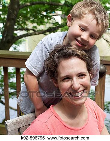 Mother and son sitting outside View Large Photo Image Stock Photograph - Mother and son sitting outside. Fotosearch