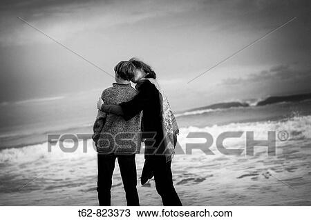 Mother and son taking a walk by the beach Kiss View Large Photo Image Stock Image - Mother and son taking a walk by the beach Kiss. Fotosearch