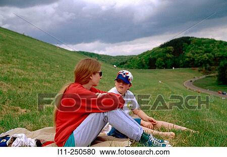 Mother and son talking at park View Large Photo Image Stock Image - Mother and son talking at park. Fotosearch