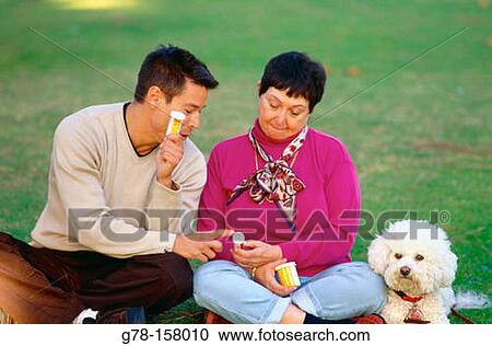Mother and son with medicines View Large Photo Image Stock Image - Mother and son with medicines. Fotosearch