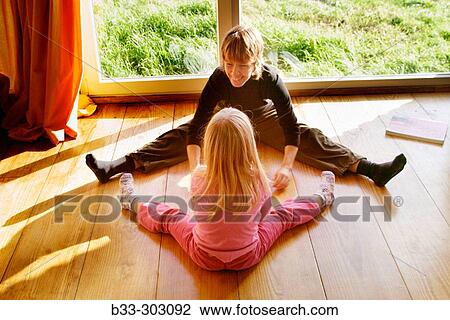 Mother and three year old daughter exercising View Large Photo Image Stock Image - Mother and three year old daughter exercising. Fotosearch