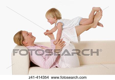Mother and toddler at a bench View Large Photo Image Picture - Mother and toddler at a bench. Fotosearch