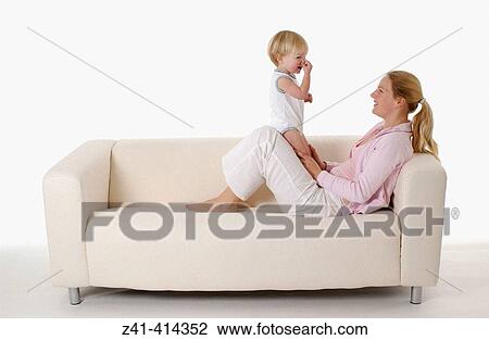 Mother and toddler at a bench View Large Photo Image Stock Image - Mother and toddler at a bench. Fotosearch
