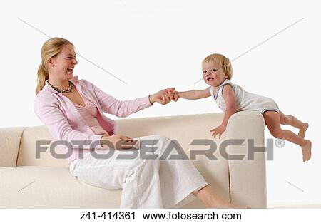 Mother and toddler at a bench View Large Photo Image Stock Image - Mother and toddler at a bench. Fotosearch