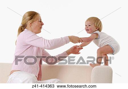 Mother and toddler at a bench View Large Photo Image Stock Image - Mother and toddler at a bench. Fotosearch