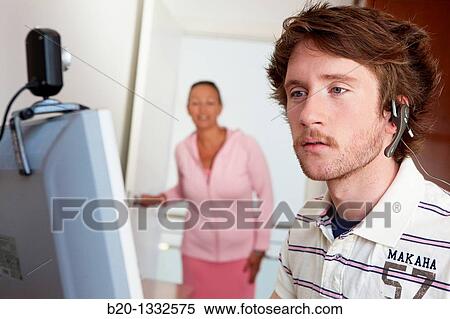 Mother calling son who is looking at computer in his room View Large Photo Image Stock Photography - Mother calling son who is looking at computer in his room. Fotosearch