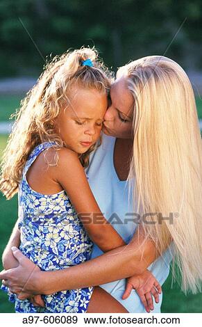 Stock Photo - Mother comforts daughter. Fotosearch