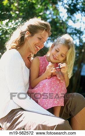 mother & daughter aplying nail polish View Large Photo Image Stock Image - mother & daughter aplying nail polish. Fotosearch