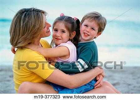 mother embracing her kids View Large Photo Image Stock Image - mother embracing her kids. Fotosearch