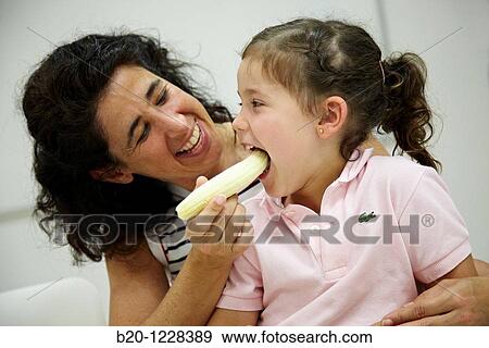 Mother giving a banana to her daughter, tasting session in sensory analysis lab, AZTI-Tecnalia Marine and Food Research Center, Derio, Bizkaia, Euskadi, Spain View Large Photo Image Stock Photo - Mother giving a banana to her daughter, tasting session in sensory analysis lab, AZTI-Tecnalia Marine and Food Research Center, Derio, Bizkaia, Euskadi, Spain. Fotosearch