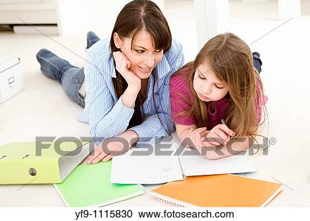 Mother Helping Daughter with Homework View Large Photo Image Stock Image - Mother Helping Daughter with Homework. Fotosearch
