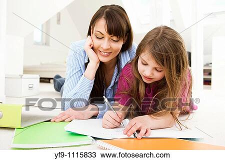 Mother Helping Daughter with Homework View Large Photo Image Stock Image - Mother Helping Daughter with Homework. Fotosearch