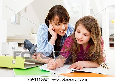 Mother Helping Daughter with Homework View Large Photo Image Stock Photo - Mother Helping Daughter with Homework. Fotosearch