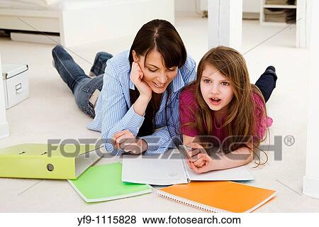 Mother Helping Daughter with Homework View Large Photo Image Stock Photo - Mother Helping Daughter with Homework. Fotosearch