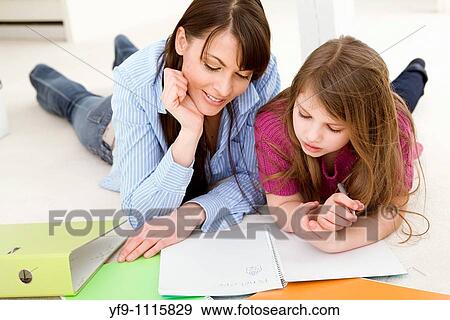 Mother Helping Daughter with Homework View Large Photo Image Stock Photo - Mother Helping Daughter with Homework. Fotosearch
