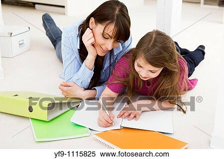 Mother Helping Daughter with Homework View Large Photo Image Stock Photography - Mother Helping Daughter with Homework. Fotosearch