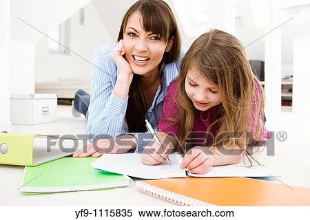 Mother Helping Daughter with Homework View Large Photo Image Stock Photography - Mother Helping Daughter with Homework. Fotosearch