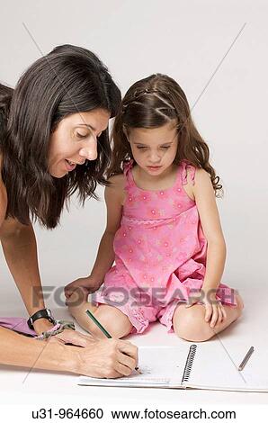 Mother helps four year old girl with her homework View Large Photo Image Stock Image - Mother helps four year old girl with her homework. Fotosearch