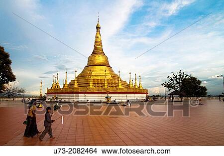 Picture - Mother & her son walking towards the Golden Shwadagon pagoda in Tachilek, Myanmar.. Fotosearch