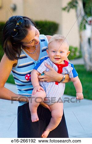 Mother holding baby View Large Photo Image Stock Image - Mother holding baby. Fotosearch