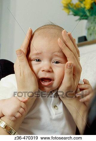 Mother holding child head View Large Photo Image Stock Photo - Mother holding child head. Fotosearch