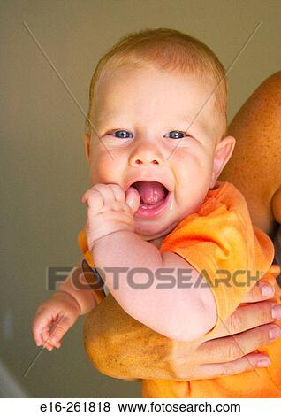 Mother holding happy baby View Large Photo Image Stock Photo - Mother holding happy baby. Fotosearch
