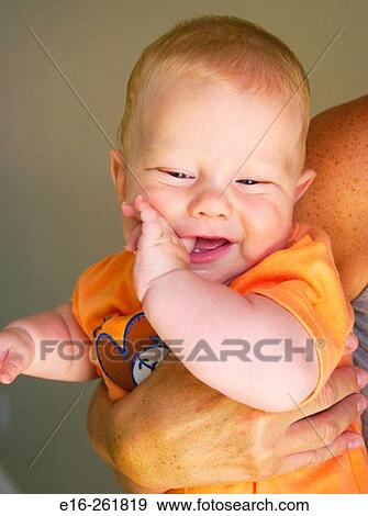 Mother holding happy baby View Large Photo Image Stock Photo - Mother holding happy baby. Fotosearch