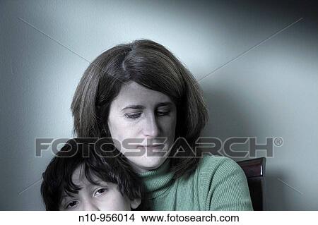 Mother holding her preteen son View Large Photo Image Picture - Mother holding her preteen son. Fotosearch