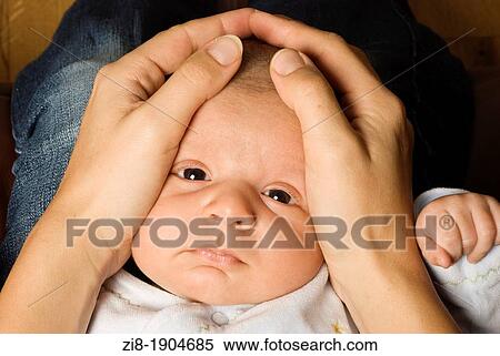 Mother holds a baby View Large Photo Image Stock Photography - Mother holds a baby. Fotosearch