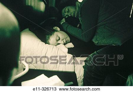 Stock Image - Mother hughs daughter. Fotosearch