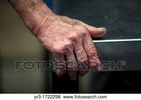 Stock Photo - Mother Ines holds a table at her home for abandoned children in Mexico City.. Fotosearch