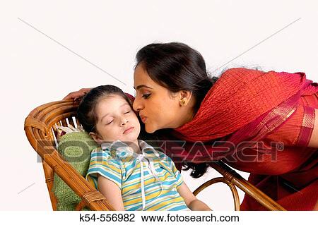 Mother kissing her daughter. View Large Photo Image Stock Image - Mother kissing her daughter.. Fotosearch