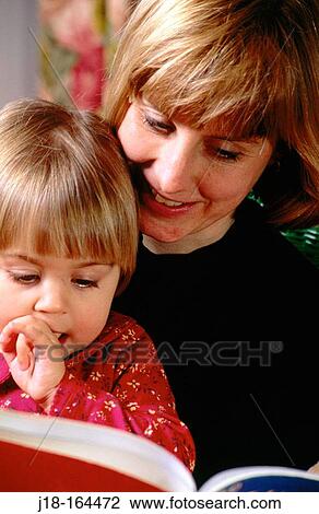 Mother reading to child View Large Photo Image Stock Image - Mother reading to child. Fotosearch