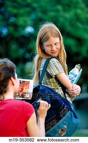 mother sending daughter off to school View Large Photo Image Stock Image - mother sending daughter off to school. Fotosearch