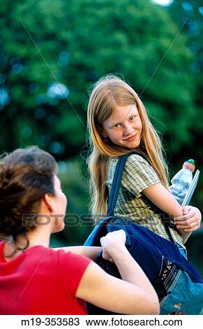 mother sending daughter off to school View Large Photo Image Stock Image - mother sending daughter off to school. Fotosearch