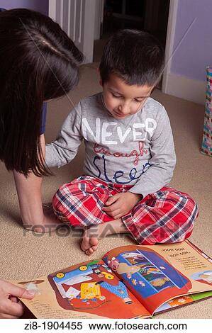 Mother teaches child to read View Large Photo Image Stock Photography - Mother teaches child to read. Fotosearch