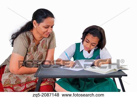 Mother teaching her daughter, Pune, India. View Large Photo Image Stock Photo - Mother teaching her daughter, Pune, India.. Fotosearch