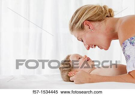 Mother with baby boy View Large Photo Image Stock Photography - Mother with baby boy. Fotosearch