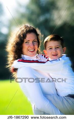 Mother with child outdoors View Large Photo Image Stock Image - Mother with child outdoors. Fotosearch