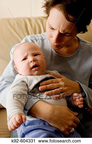 Stock Image - Mother with four month old baby.. Fotosearch