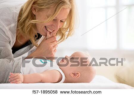Stock Photo - Mother with her baby son. Fotosearch