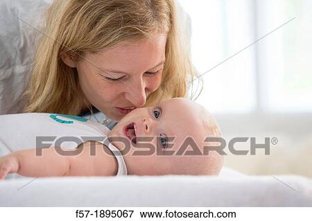 Mother with her baby son View Large Photo Image Stock Photo - Mother with her baby son. Fotosearch