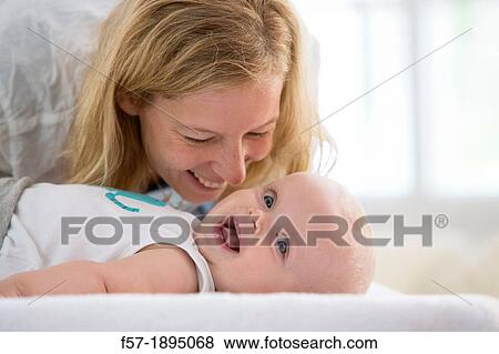 Mother with her baby son View Large Photo Image Stock Photo - Mother with her baby son. Fotosearch