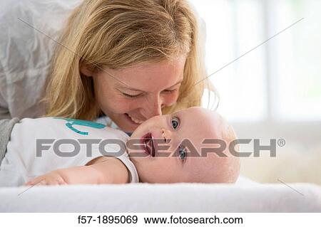 Stock Photo - Mother with her baby son. Fotosearch