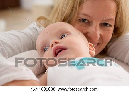 Mother with her baby son View Large Photo Image Stock Photo - Mother with her baby son. Fotosearch