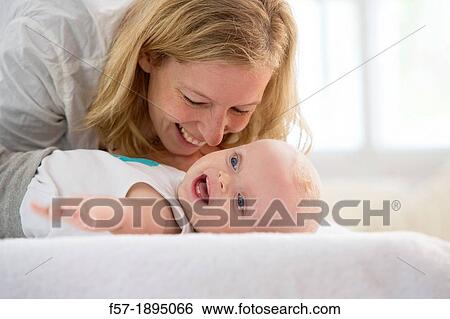Mother with her baby son View Large Photo Image Stock Photograph - Mother with her baby son. Fotosearch