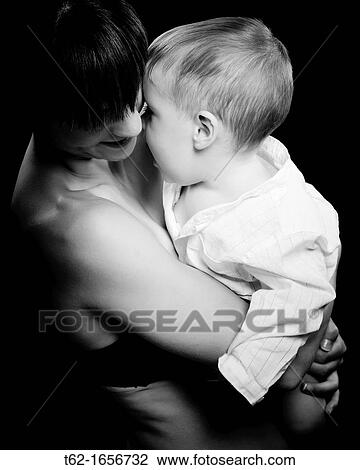 Stock Image - Mother with her child Spotlight: Black and White. Fotosearch